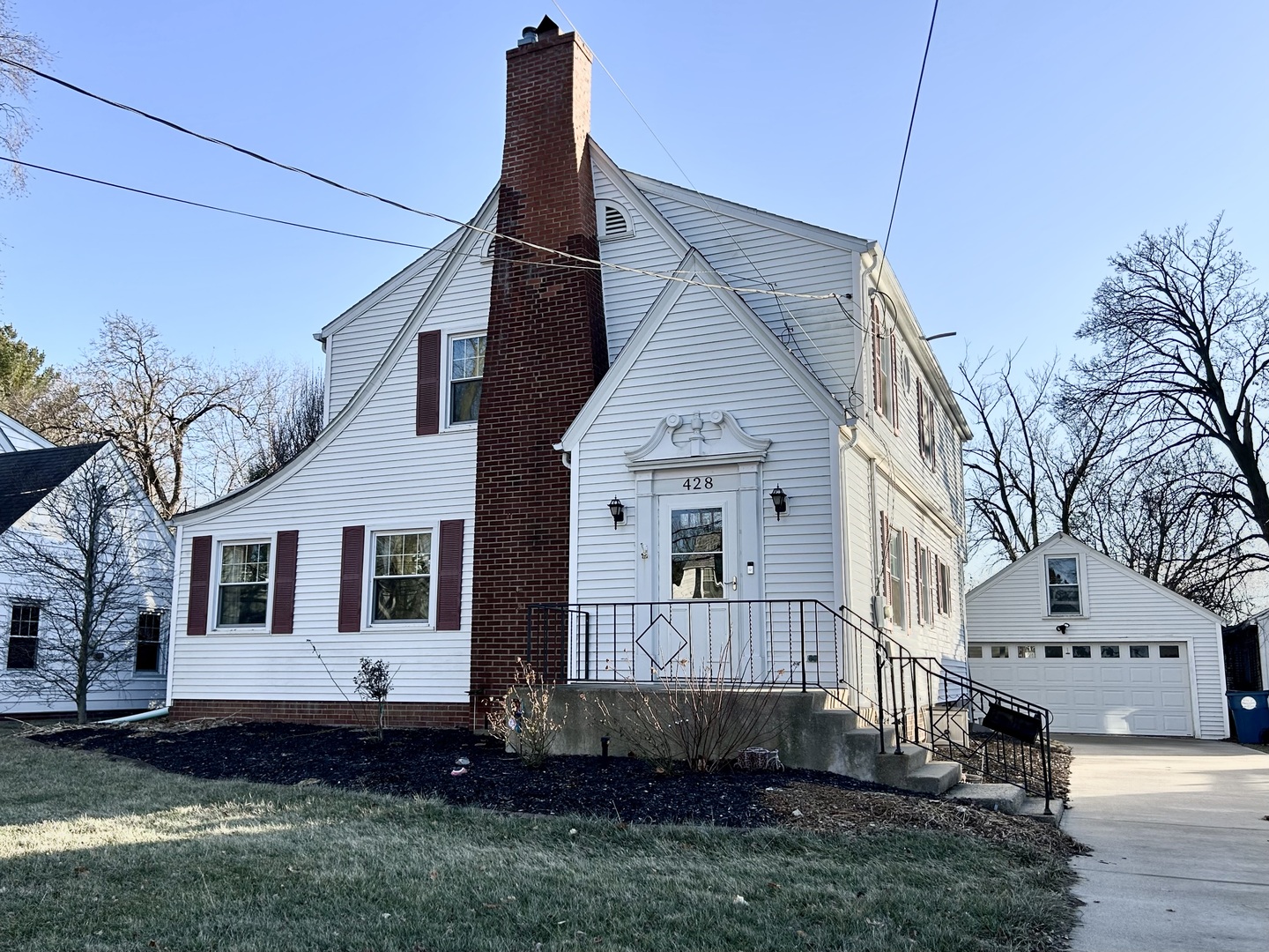 a view of front of house with a yard