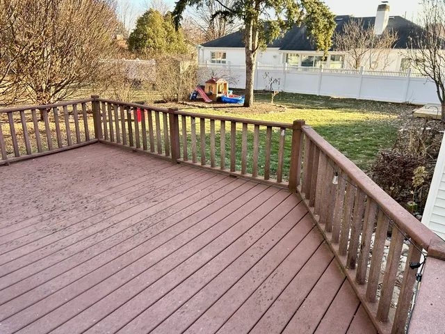 a balcony with wooden floor