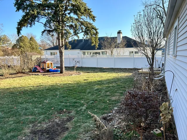 a view of a house with swimming pool and sitting area