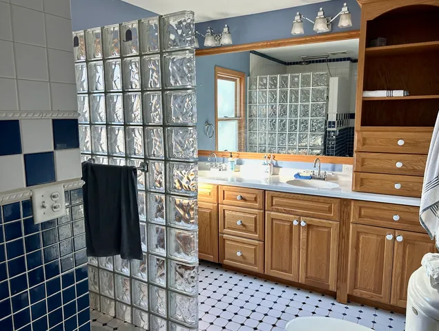 a bathroom with a sink and a mirror