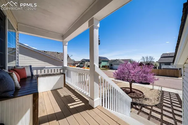 a view of balcony with wooden floor