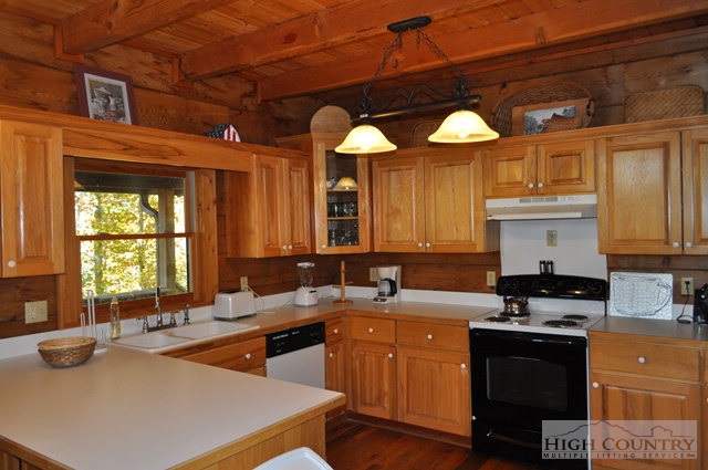 346-348 Grady Winkler Road Boone, NC 28607 - Photo 22 of 32 a kitchen with a sink stove and cabinets