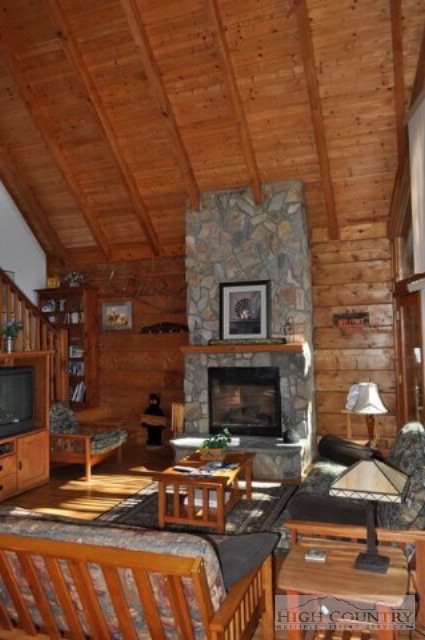 346-348 Grady Winkler Road Boone, NC 28607 - Photo 25 of 32 a living room with fireplace furniture and a fireplace