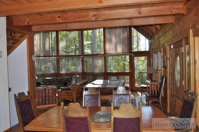 346-348 Grady Winkler Road Boone, NC 28607 - Photo 26 of 32 a living room with furniture and floor to ceiling windows