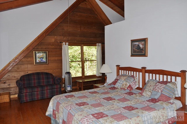 346-348 Grady Winkler Road Boone, NC 28607 - Photo 28 of 32 a bedroom with bed and a window
