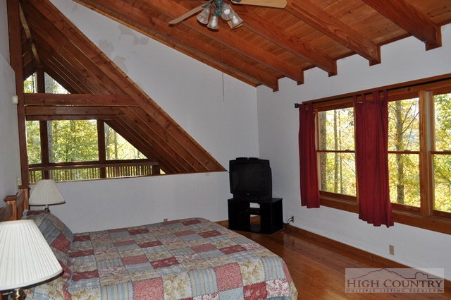 346-348 Grady Winkler Road Boone, NC 28607 - Photo 29 of 32 a bedroom with furniture and windows