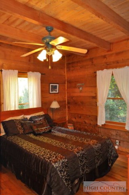 346-348 Grady Winkler Road Boone, NC 28607 - Photo 32 of 32 a bedroom with a bed and a window
