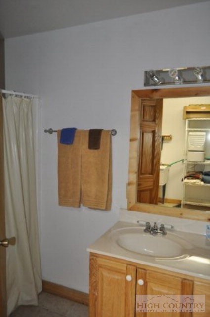 346-348 Grady Winkler Road Boone, NC 28607 - Photo 6 of 32 a bathroom with a sink and a mirror