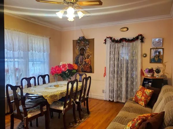 a bedroom with furniture and wooden floor