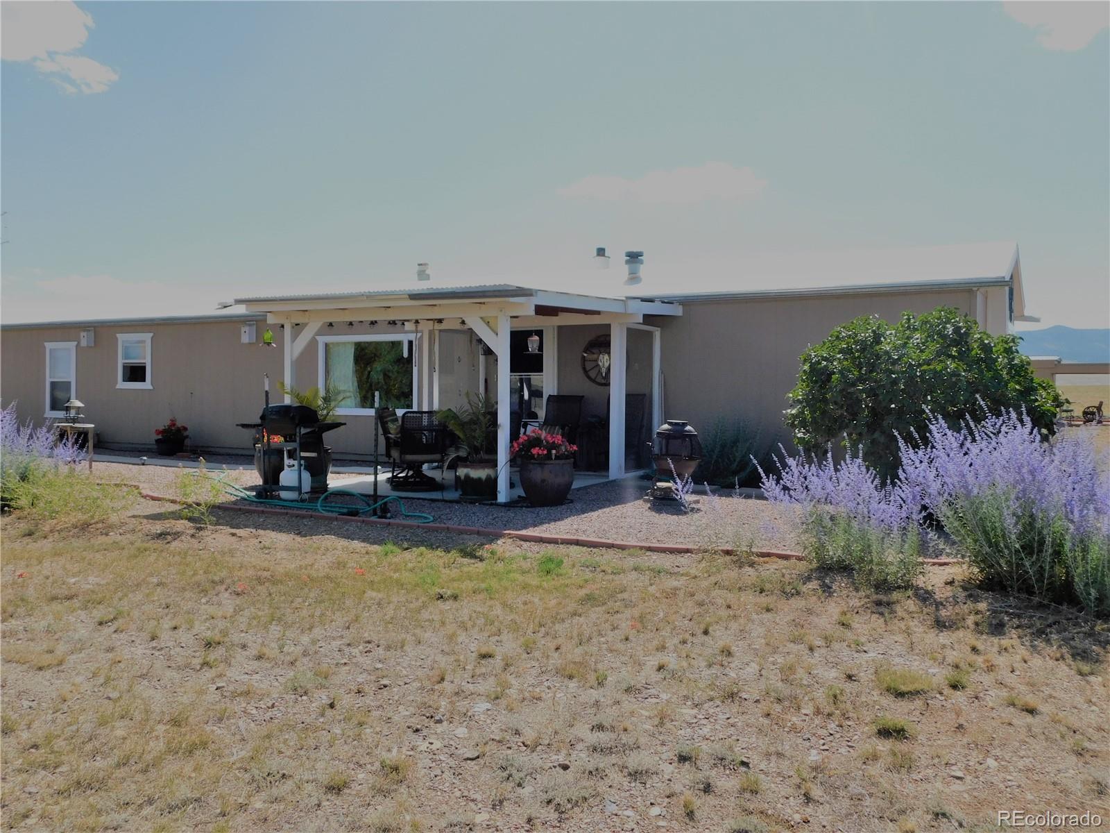 a view of a livingroom with furniture and a patio