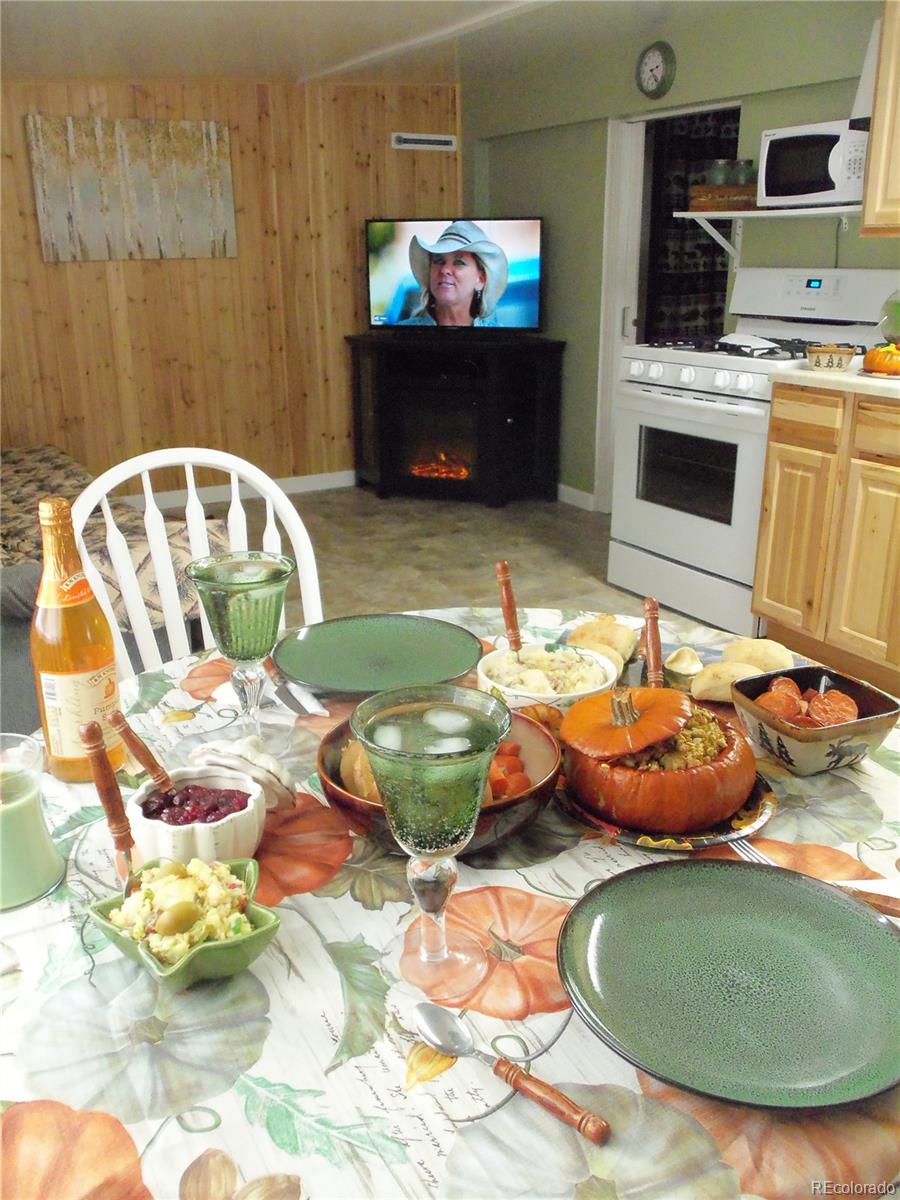 59501 County Rd GG Moffat, CO 81143 - Photo 12 of 25 a living room with furniture and a wooden floor