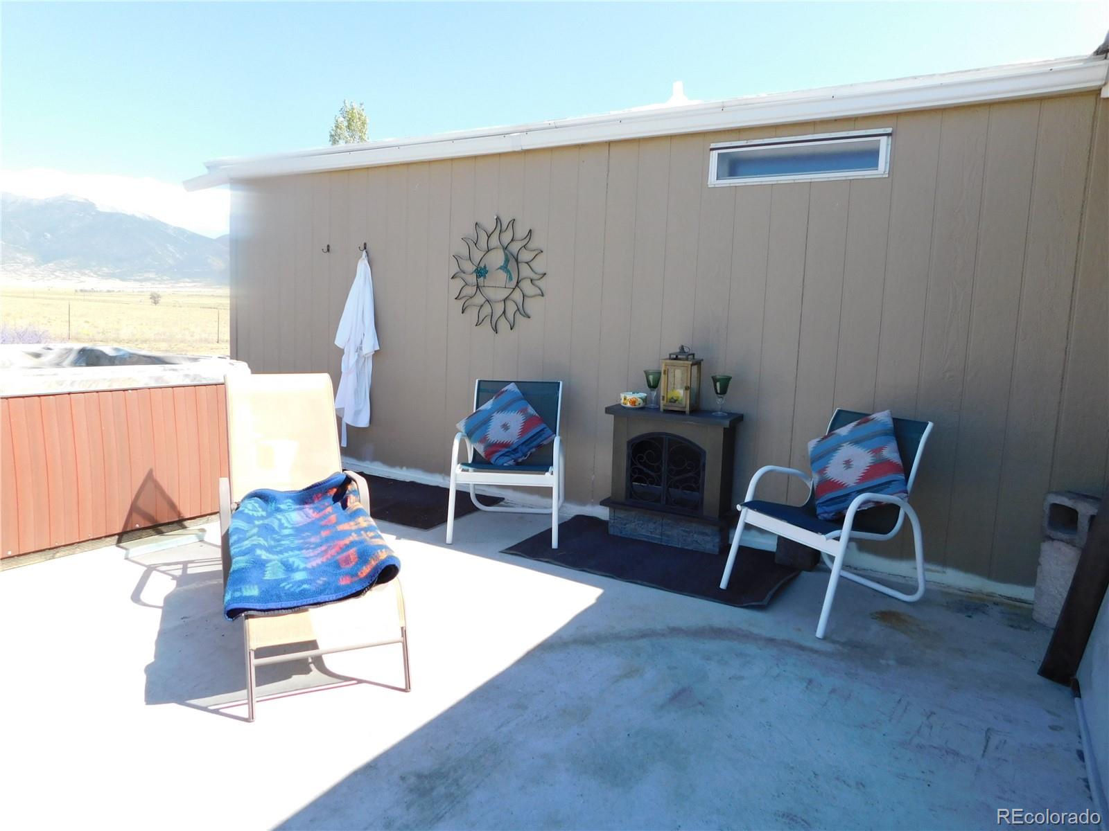 59501 County Rd GG Moffat, CO 81143 - Photo 16 of 25 a living room with furniture and a table