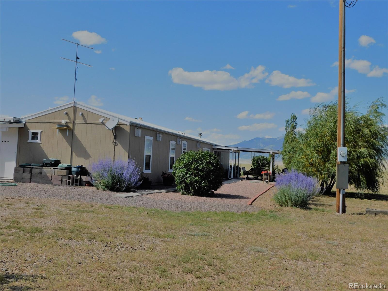 59501 County Rd GG Moffat, CO 81143 - Photo 2 of 25 a front view of a house with a yard
