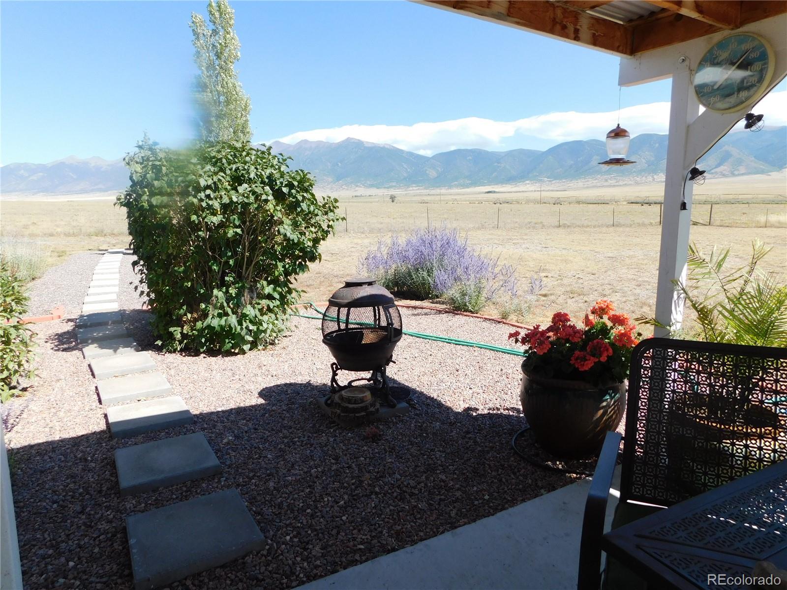 59501 County Rd GG Moffat, CO 81143 - Photo 24 of 25 a view of a lake with a floor to ceiling window