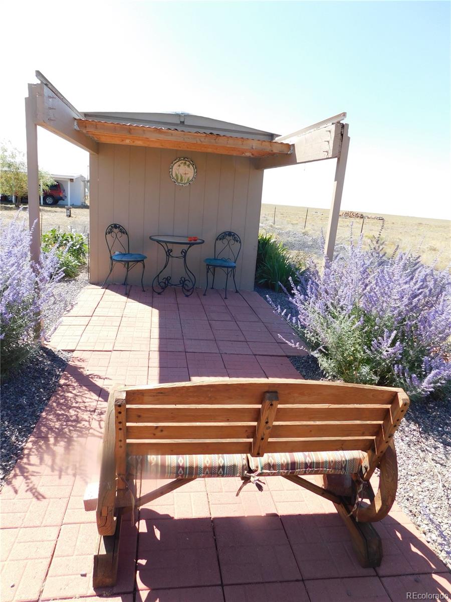 59501 County Rd GG Moffat, CO 81143 - Photo 25 of 25 a backyard view of a house with basket ball court