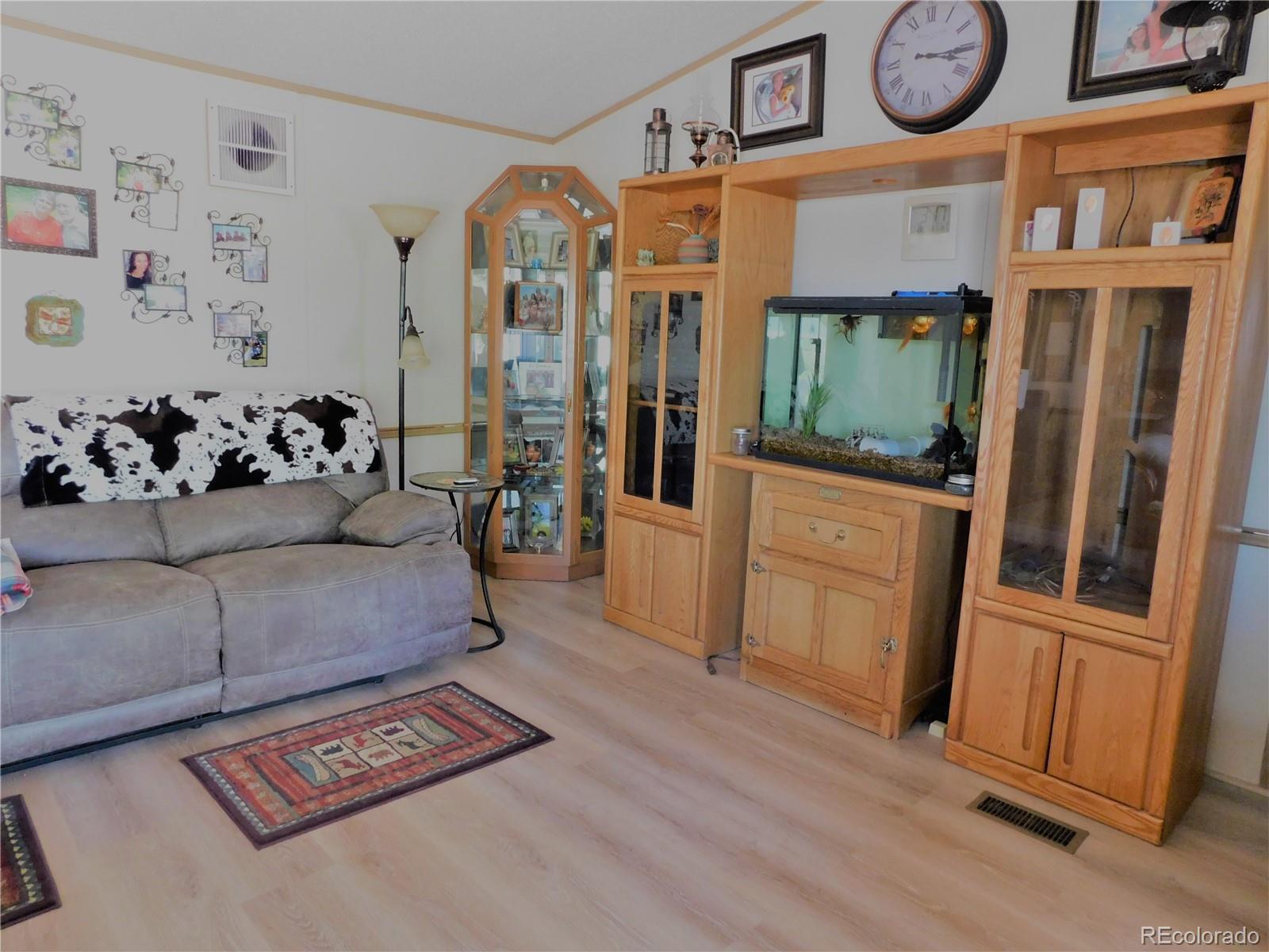 59501 County Rd GG Moffat, CO 81143 - Photo 3 of 25 a living room with furniture and a fireplace
