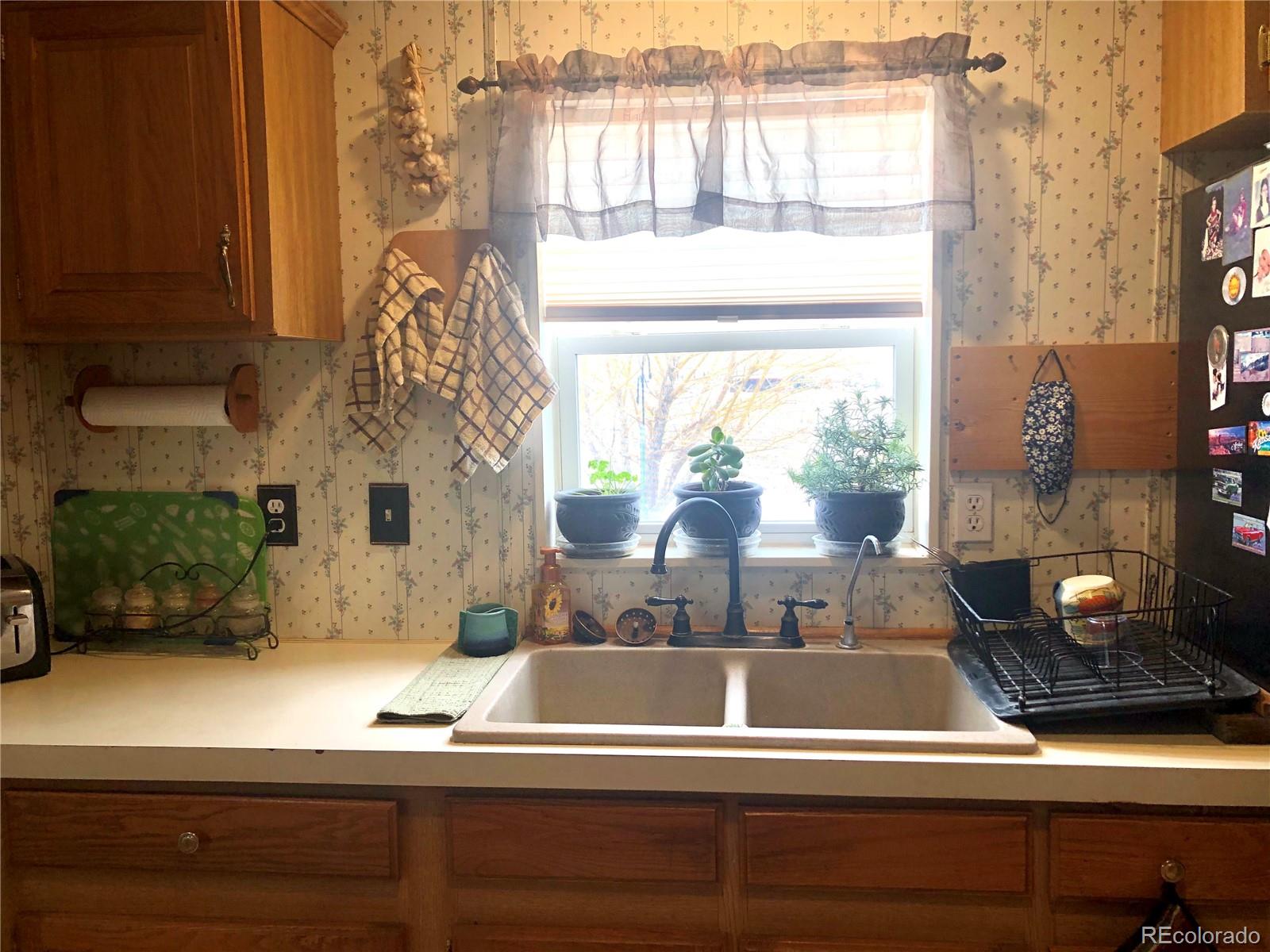 59501 County Rd GG Moffat, CO 81143 - Photo 6 of 25 a living room with furniture and a window