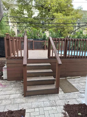 a view of a house with a yard and sitting area