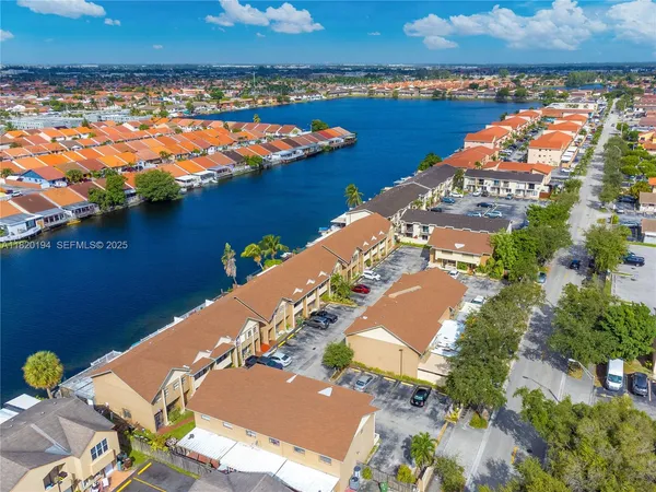 an aerial view of a house with a lake view