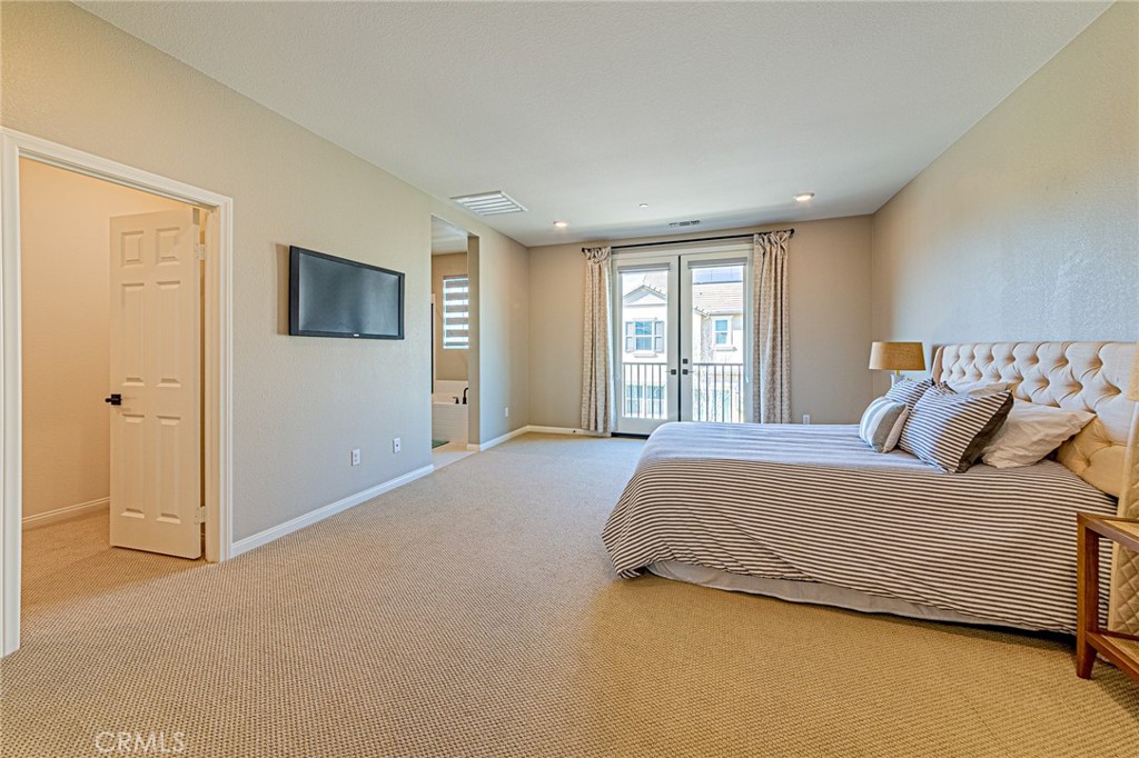 1705 Almond Tree Place Upland, CA 91784 - Photo 15 of 41 a bedroom with a bed and a flat screen tv