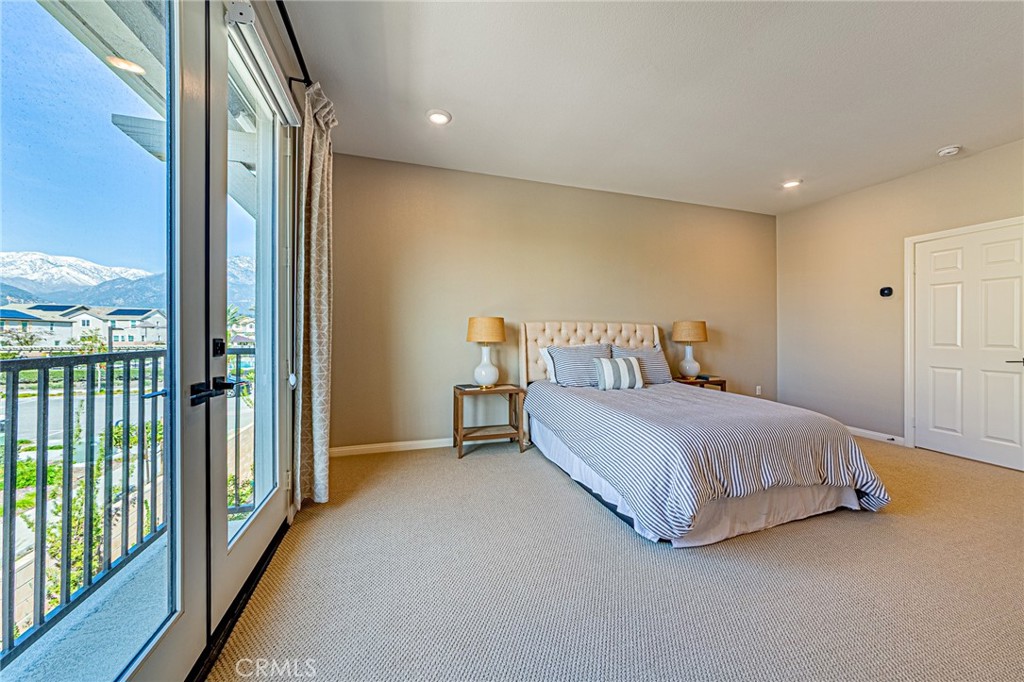 1705 Almond Tree Place Upland, CA 91784 - Photo 16 of 41 a bedroom with a bed and a large window