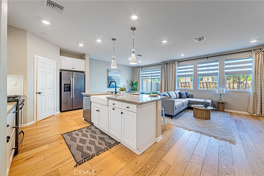 1705 Almond Tree Place Upland, CA 91784 - Photo 2 of 41 a large white kitchen with a large window