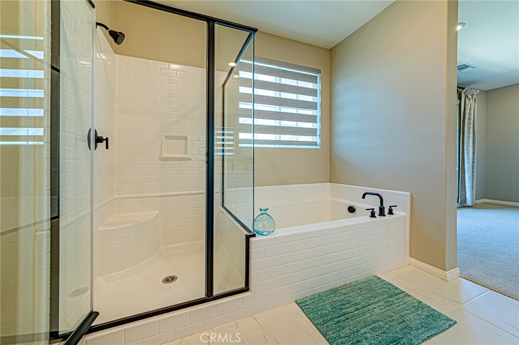 1705 Almond Tree Place Upland, CA 91784 - Photo 22 of 41 a bathroom with a bathtub and a shower