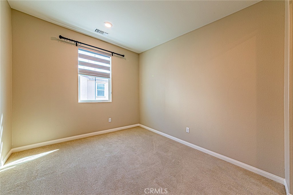 1705 Almond Tree Place Upland, CA 91784 - Photo 25 of 41 an empty room with windows