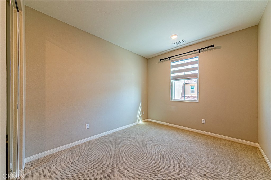 1705 Almond Tree Place Upland, CA 91784 - Photo 27 of 41 a view of an empty room with a window