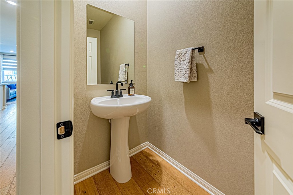 1705 Almond Tree Place Upland, CA 91784 - Photo 31 of 41 a bathroom with a sink and mirror