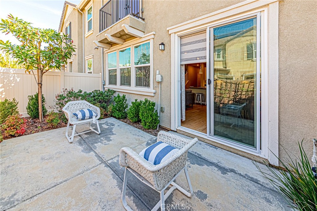 1705 Almond Tree Place Upland, CA 91784 - Photo 34 of 41 a backyard of a house with a floor to ceiling window and outdoor seating