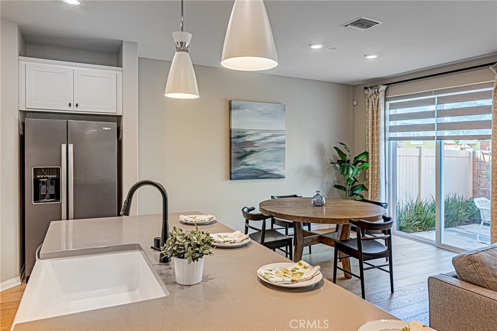 1705 Almond Tree Place Upland, CA 91784 - Photo 6 of 41 a kitchen with a table and chairs in it