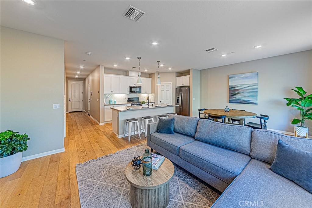 1705 Almond Tree Place Upland, CA 91784 - Photo 10 of 41 a living room with furniture kitchen and a potted plant
