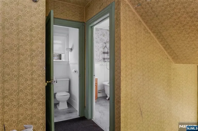 a bathroom with a granite countertop shower