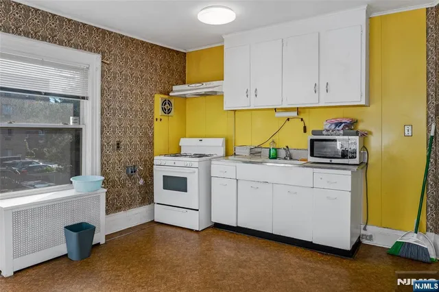 a kitchen with a sink and cabinets