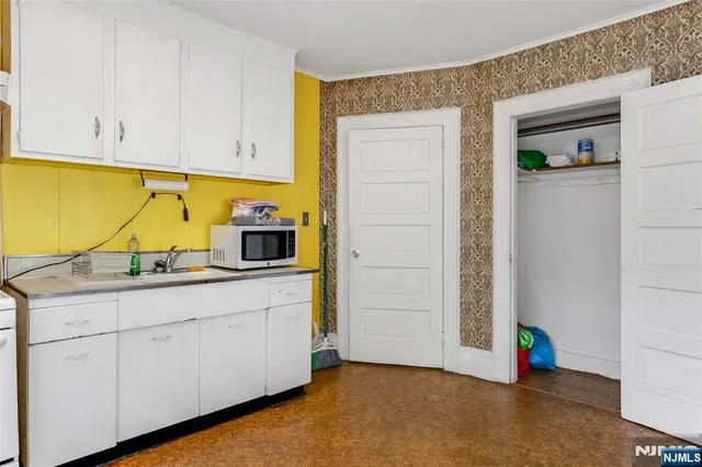 a kitchen with a sink and cabinets