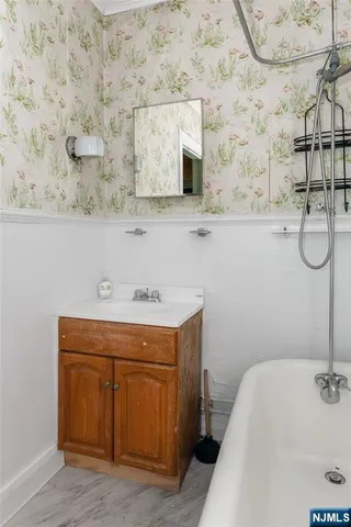 a bathroom with a sink and a mirror