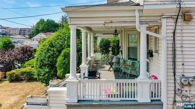 a view of a house with porch and wooden floor