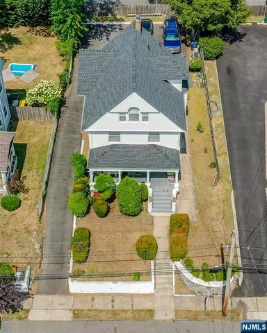 an aerial view of a house with yard
