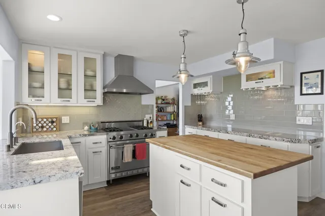 a bedroom with a large bed and a large window