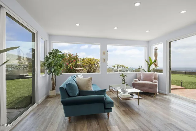 a view of a balcony with an ocean view