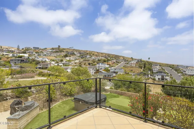 a bedroom with a bed and painting on the wall