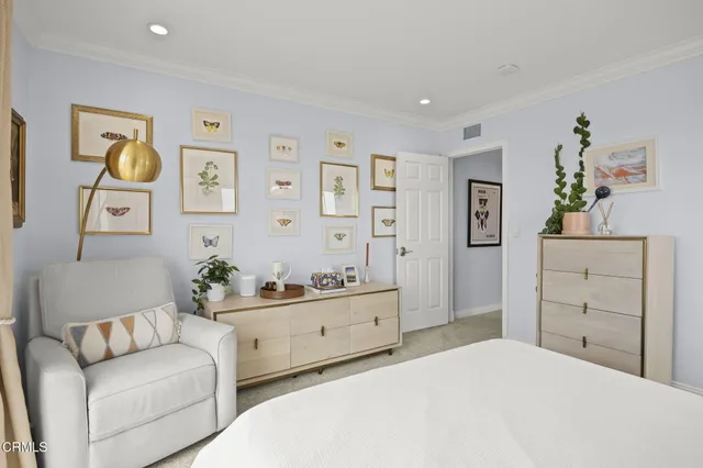 a bedroom with a bed and a flat tv screen