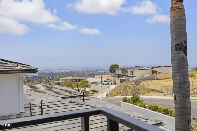 a view of a house with swimming pool and sitting area