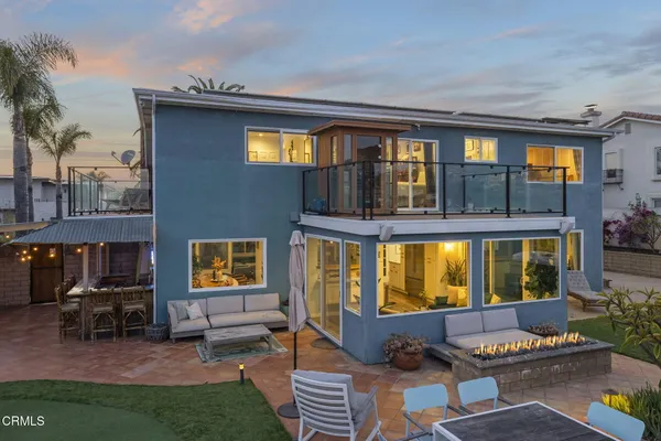 a view of living room filled with furniture and floor to ceiling window