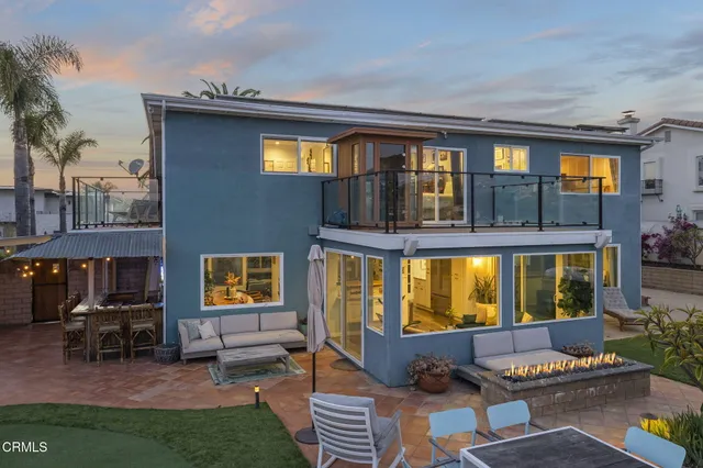 a view of living room filled with furniture and floor to ceiling window