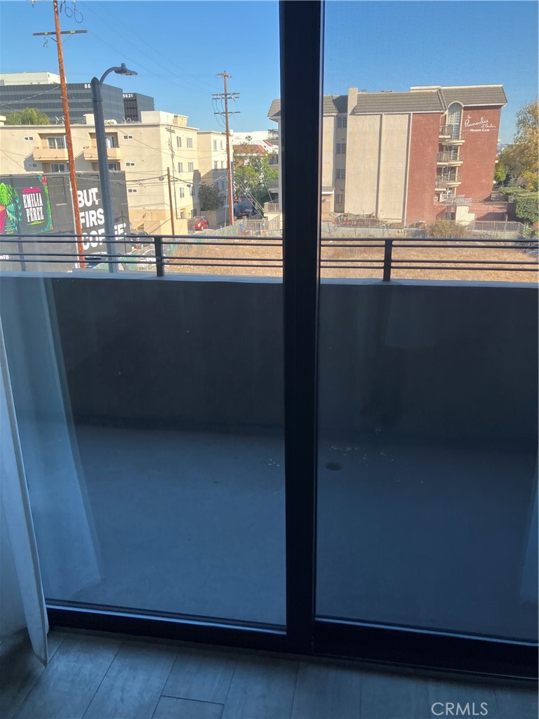 8811 Burton Way, Unit 202 Los Angeles, CA 90048 - Photo 14 of 19 a view of kitchen with furniture and window