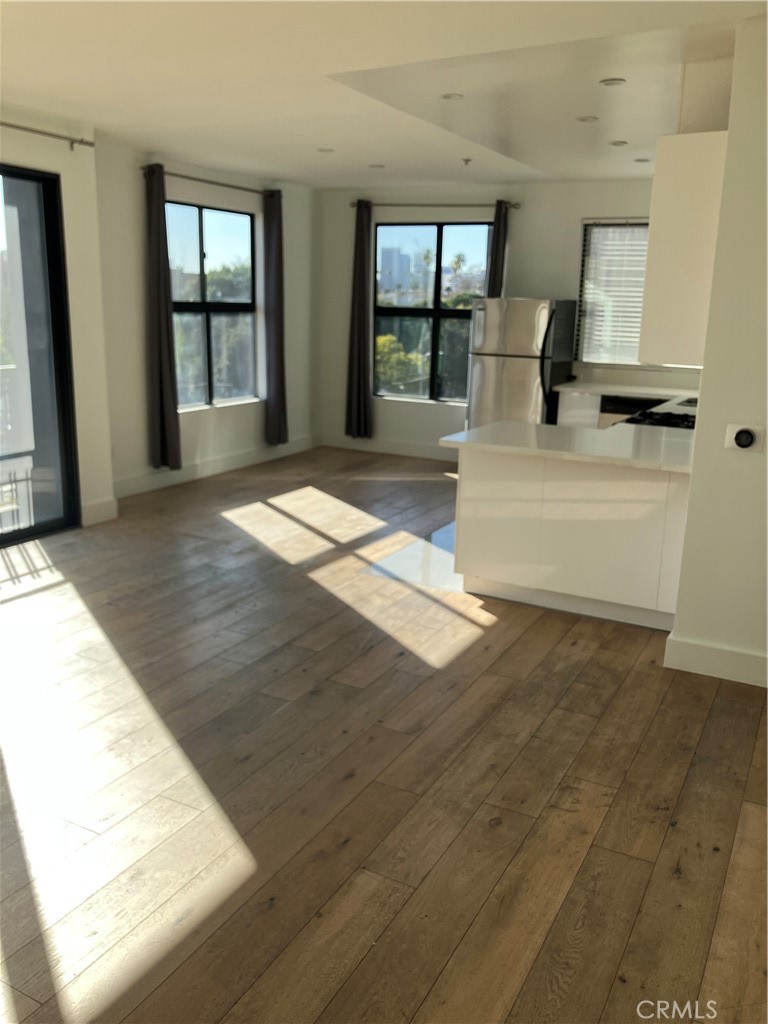 8811 Burton Way, Unit 202 Los Angeles, CA 90048 - Photo 2 of 19 a living room with granite countertop sink and cabinets