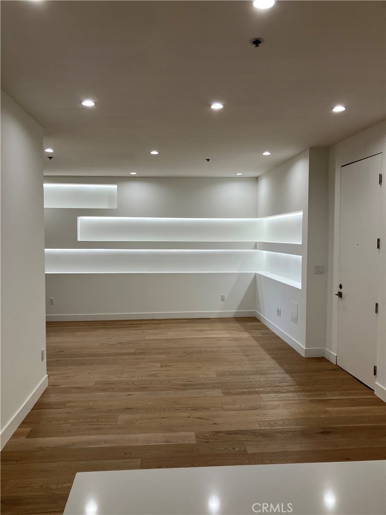 8811 Burton Way, Unit 202 Los Angeles, CA 90048 - Photo 8 of 19 a view of a room with wooden floor