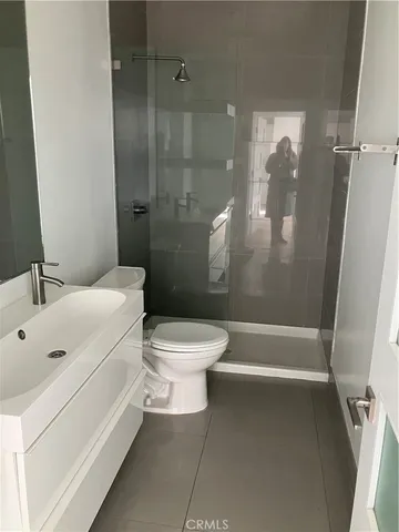 a bathroom with a toilet and shower